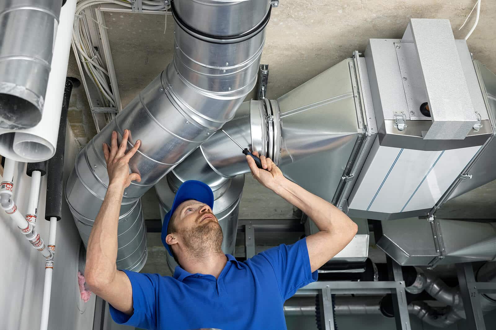 HVAC technician inspecting and repairing air ducts in Temple City