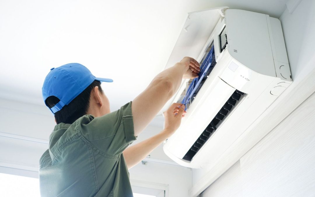 HVAC technician servicing a ductless mini split in Temple City
