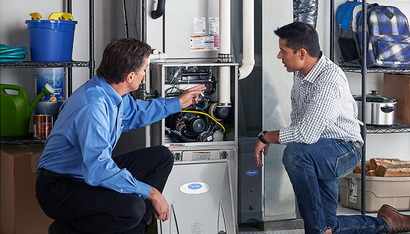 Technician evaluating a furnace for repair or replacement in Temple City