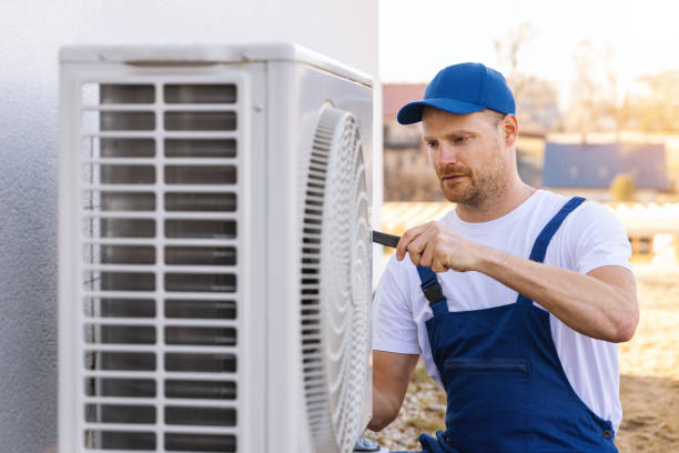 HVAC technician servicing an outdoor air conditioner in Temple City