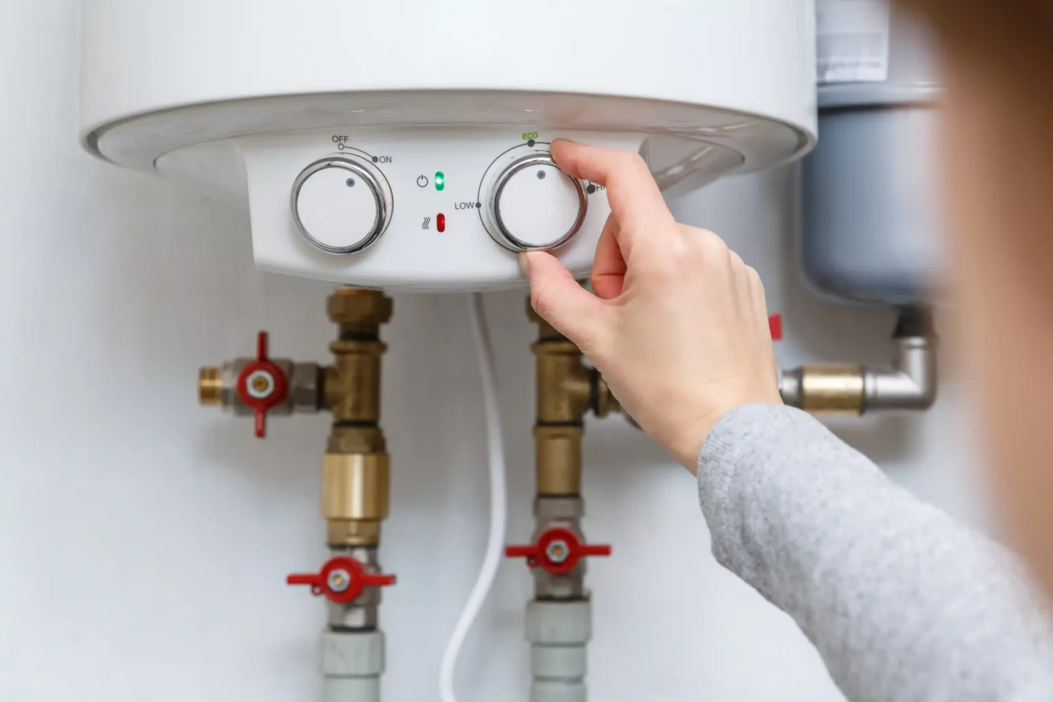 Technician adjusting a water heater in Temple City